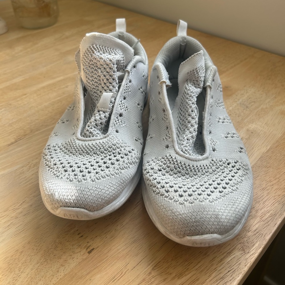 White APL tennis shoes